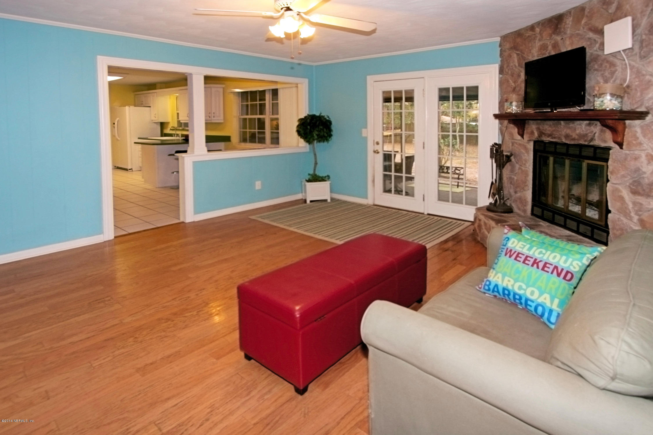 6404 Heidi Road Jacksonville, FL 32277 - Photo 5 of 26 a room with furniture and a flat screen tv
