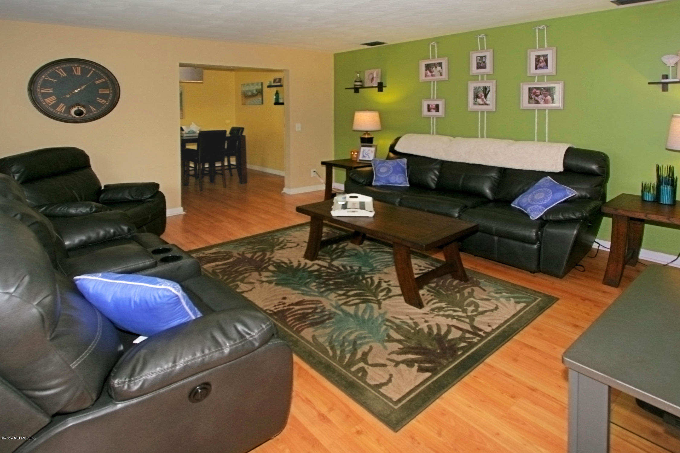 6404 Heidi Road Jacksonville, FL 32277 - Photo 6 of 26 a living room with furniture and a rug
