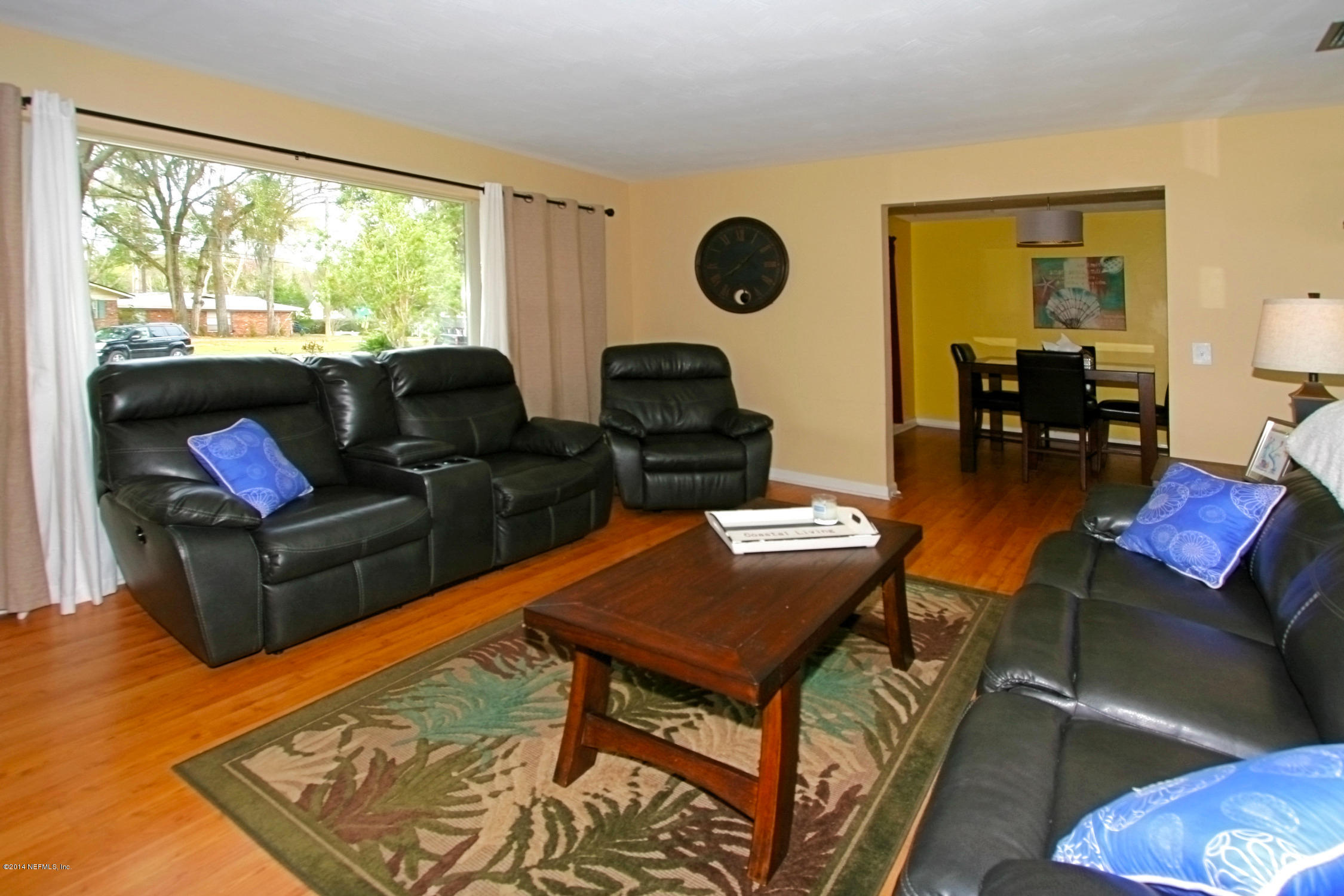 6404 Heidi Road Jacksonville, FL 32277 - Photo 7 of 26 a living room with furniture and a large window