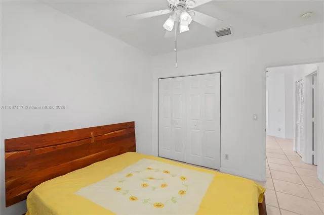 a bed room with a bed and a chandelier