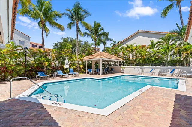 a view of a swimming pool with a patio