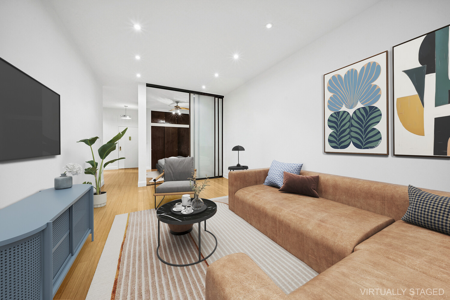 159 Madison Avenue, Unit 9B Manhattan, NY 10016 - Photo 3 of 16 a living room with furniture and a flat screen tv