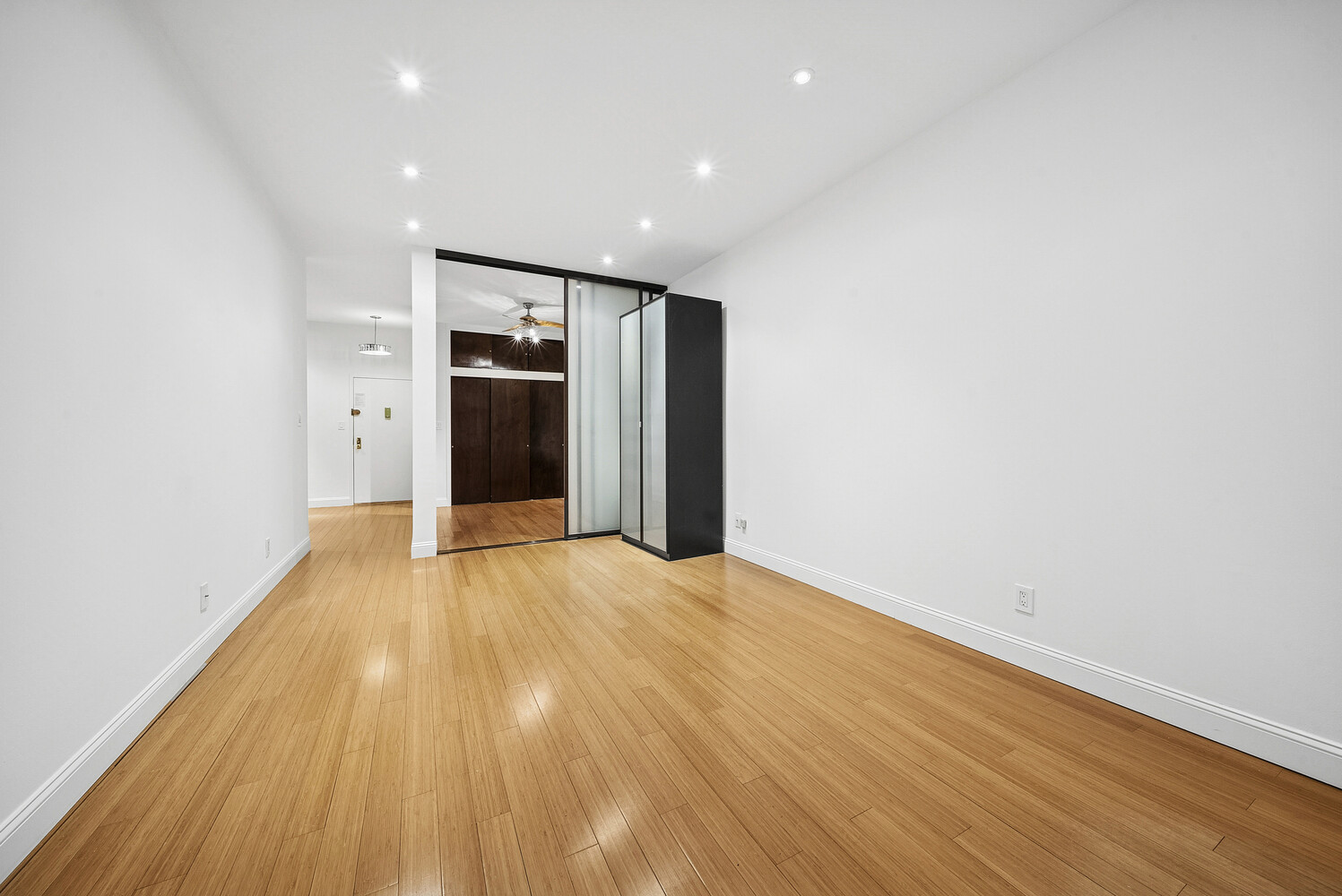 159 Madison Avenue, Unit 9B Manhattan, NY 10016 - Photo 4 of 16 a view of empty room with wooden floor