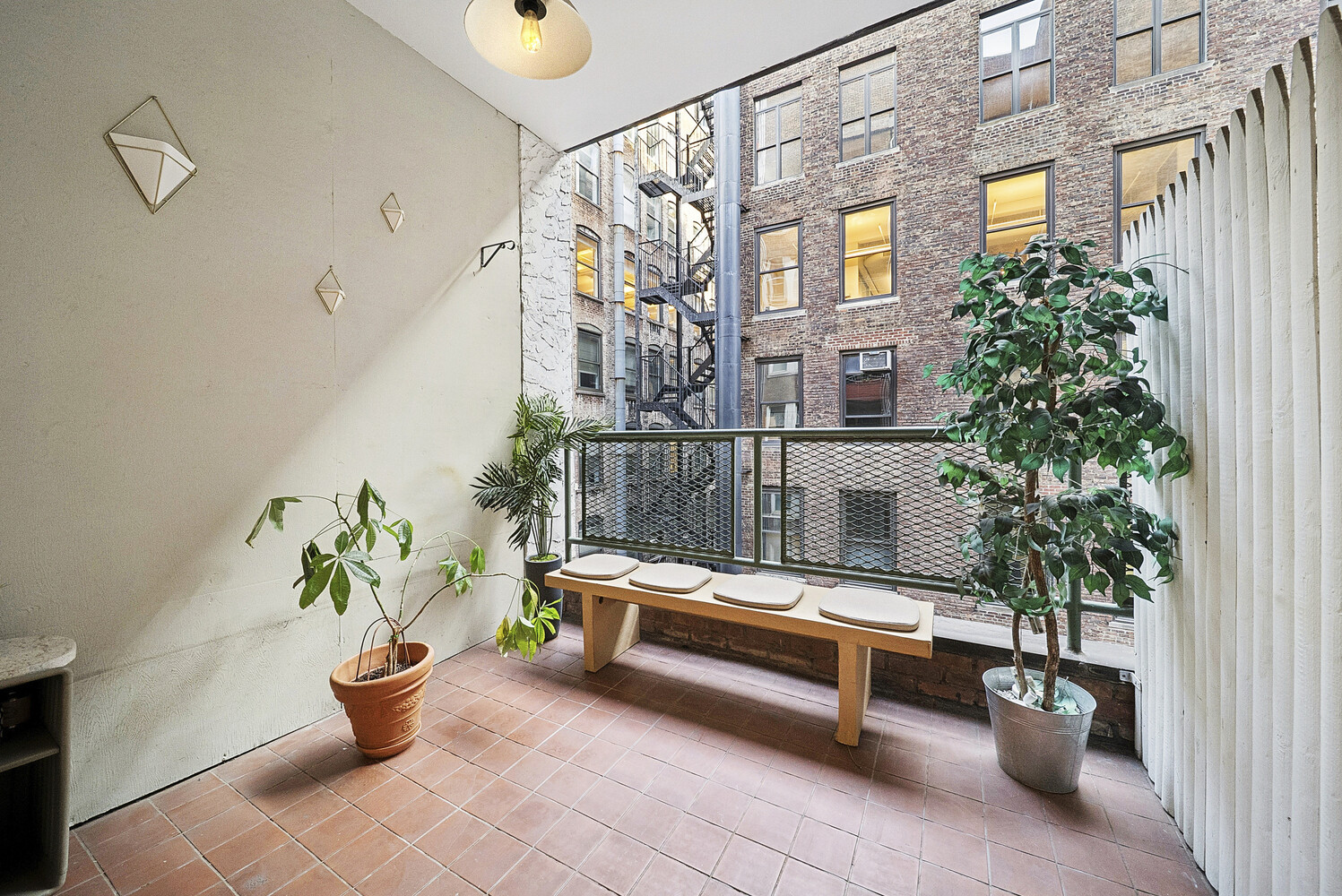 159 Madison Avenue, Unit 9B Manhattan, NY 10016 - Photo 8 of 16 a bench sitting in front of a building