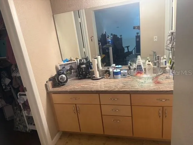 a bathroom with a sink and a mirror