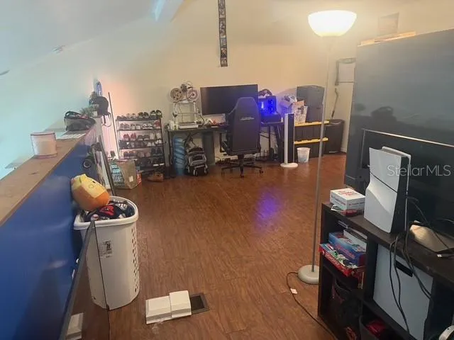 a room with furniture and a wooden floor