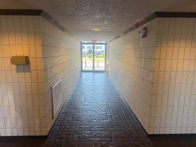 a view of a bathroom with wooden floor