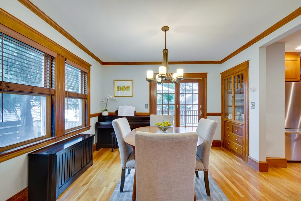 15 Brier Road Boston, MA 02132 - Photo 8 of 32 a view of a dining room with furniture a chandelier and wooden floor
