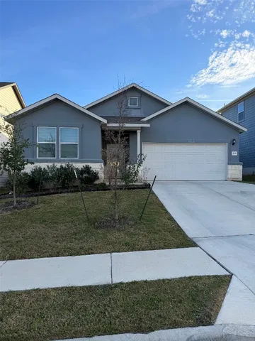 a front view of a house with garage