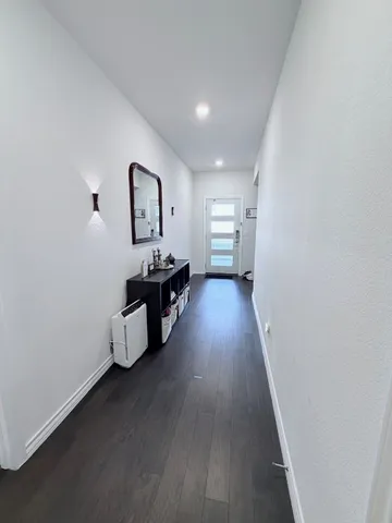 a view of a livingroom with wooden floor
