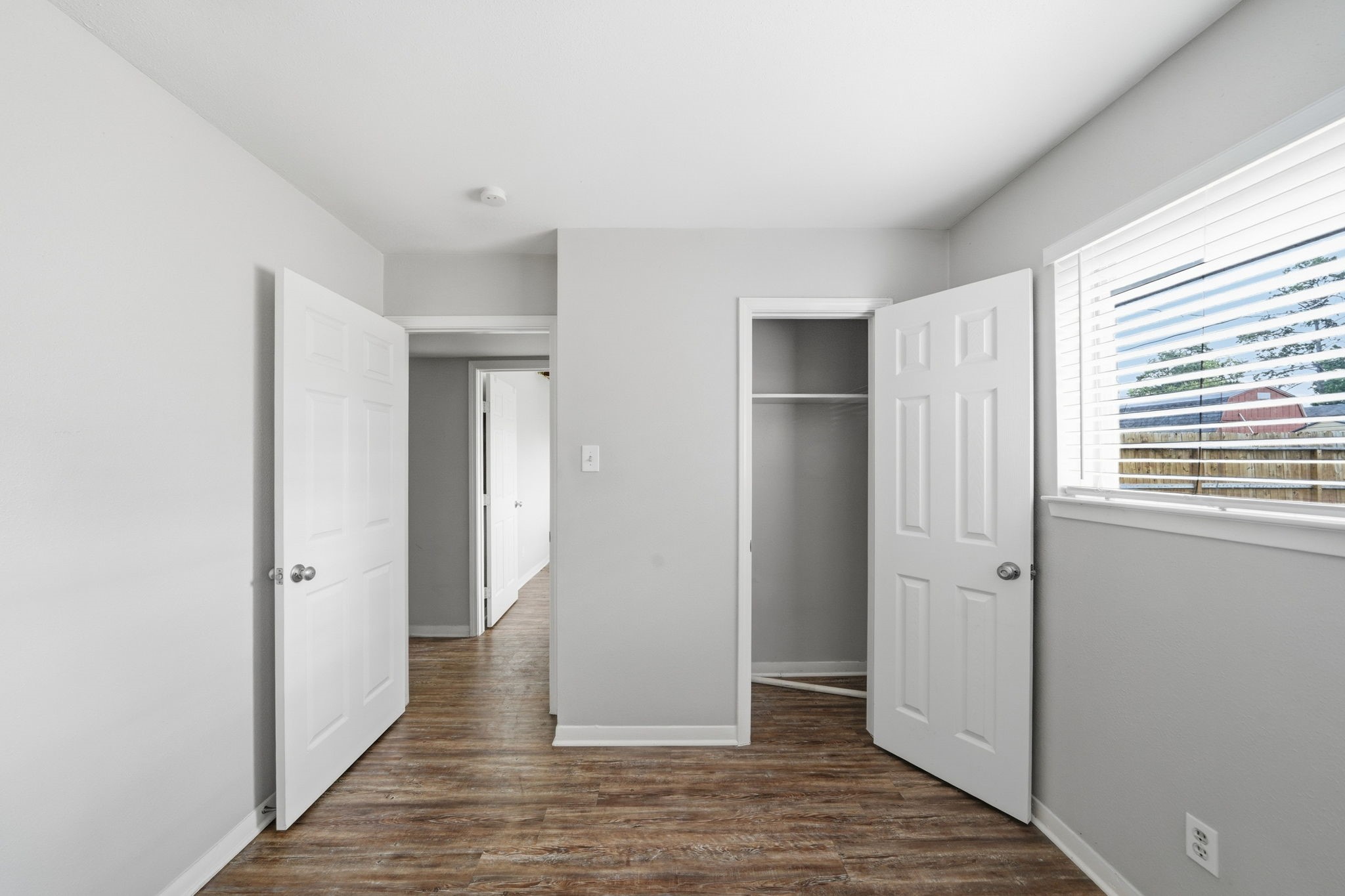 6410 Hopper Road Houston, TX 77016 - Photo 17 of 28 a view of a hallway with wooden floor and closet