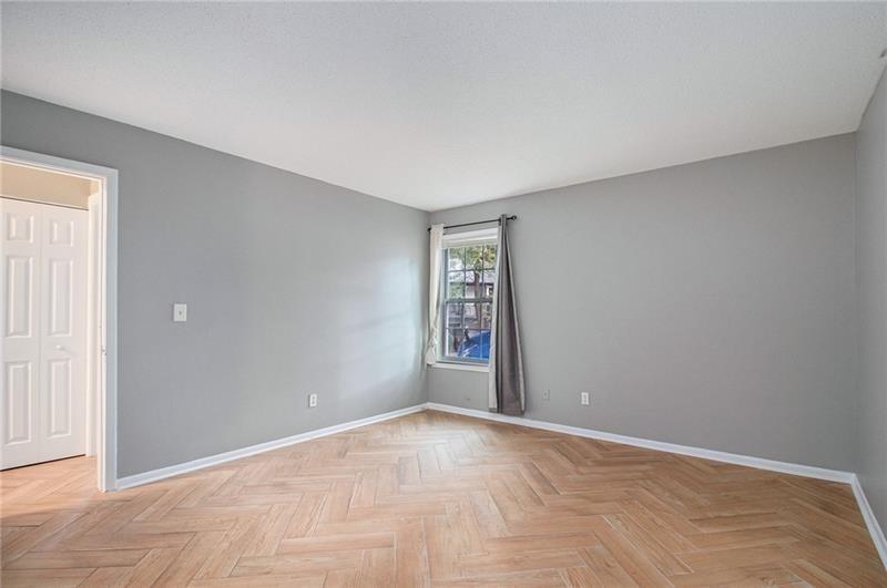 3599 Woodbriar Circle, Unit A Tucker, GA 30084 - Photo 16 of 30 a view of an empty room with window and stairs