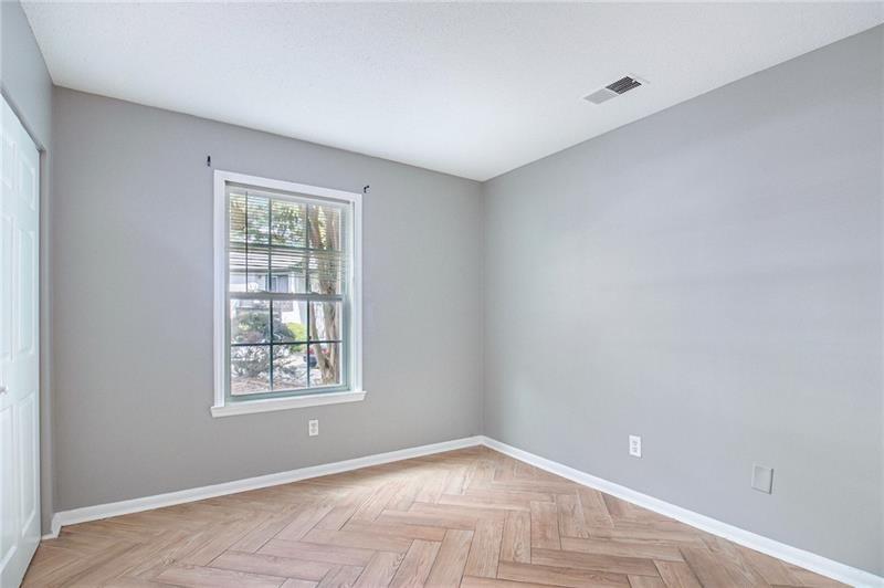 3599 Woodbriar Circle, Unit A Tucker, GA 30084 - Photo 26 of 30 an empty room with windows and closet