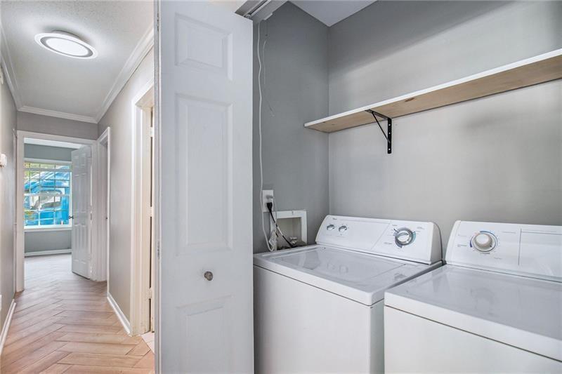 3599 Woodbriar Circle, Unit A Tucker, GA 30084 - Photo 29 of 30 a view of washer and dryer with bathroom in the background