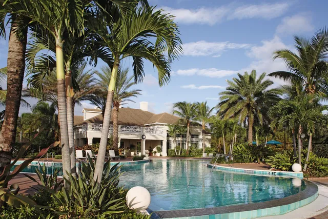 a view of swimming pool with outdoor seating and plants