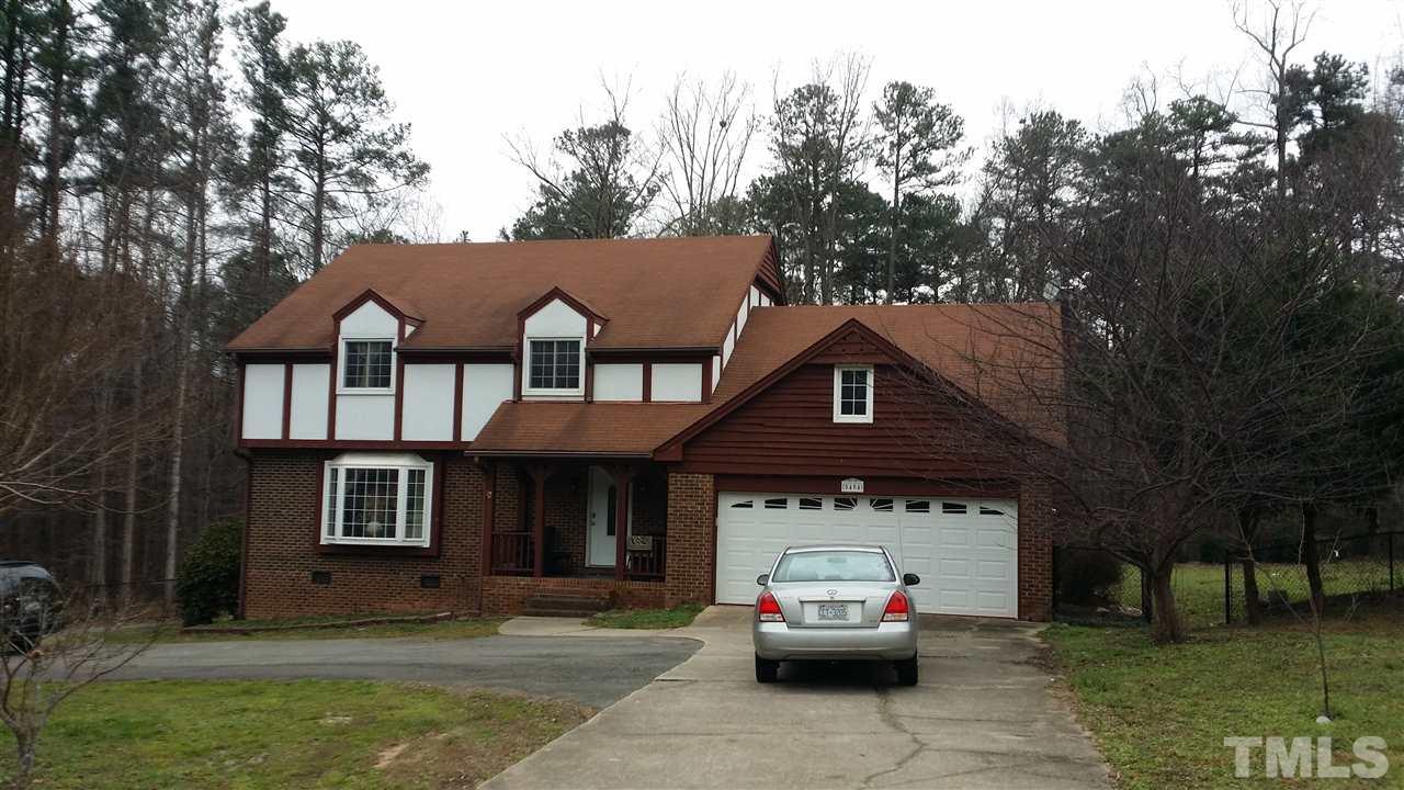 5404 Live Oak Trail Raleigh, NC 27613 - Photo 2 of 14 a front view of a house with a garden