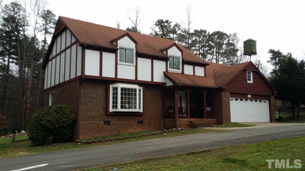 5404 Live Oak Trail Raleigh, NC 27613 - Photo 7 of 14 a front view of a house with a yard
