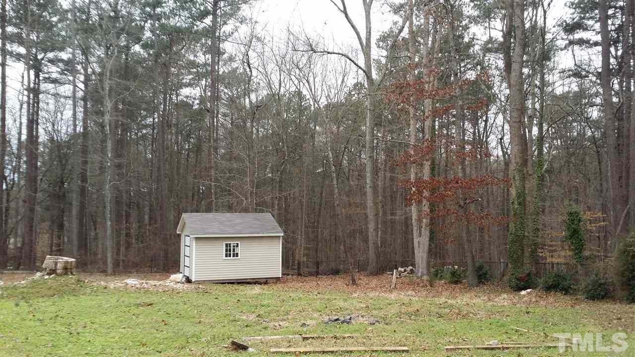 5404 Live Oak Trail Raleigh, NC 27613 - Photo 9 of 14 a house with trees in the background