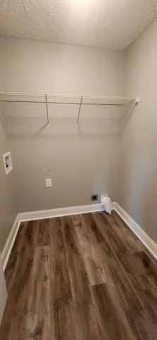 a view of a room with racks on the wall