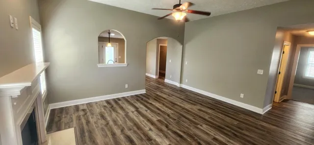 wooden floor in an empty room with a mirror