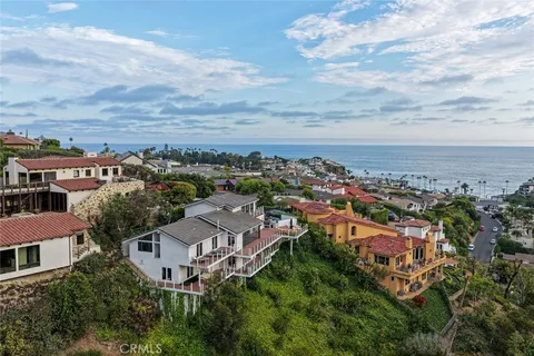 an aerial view of residential building with green space