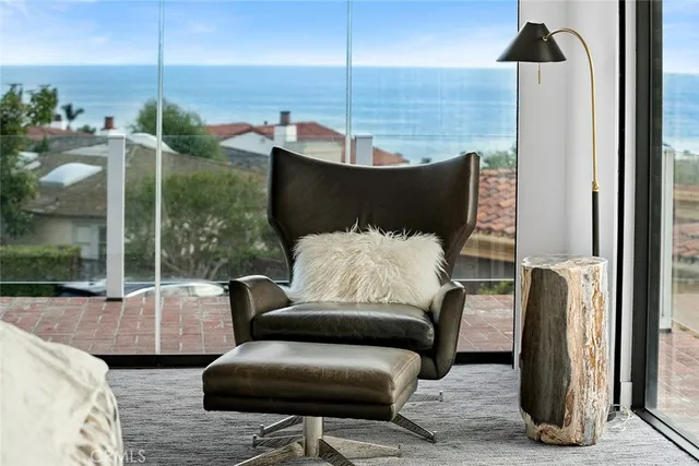 a living room with furniture and a glass door