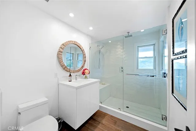 a bathroom with a sink toilet and shower