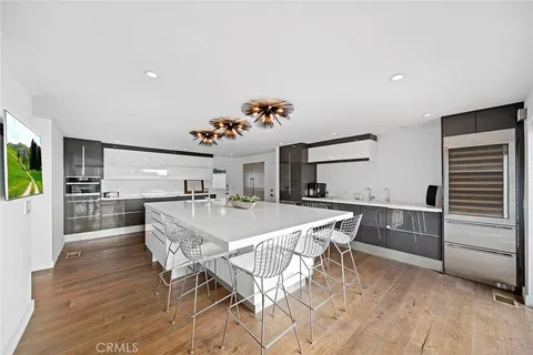 a kitchen with a table and chairs in it