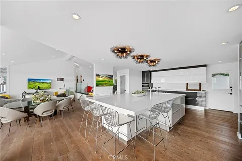 a very nice looking dining room with a table and chairs