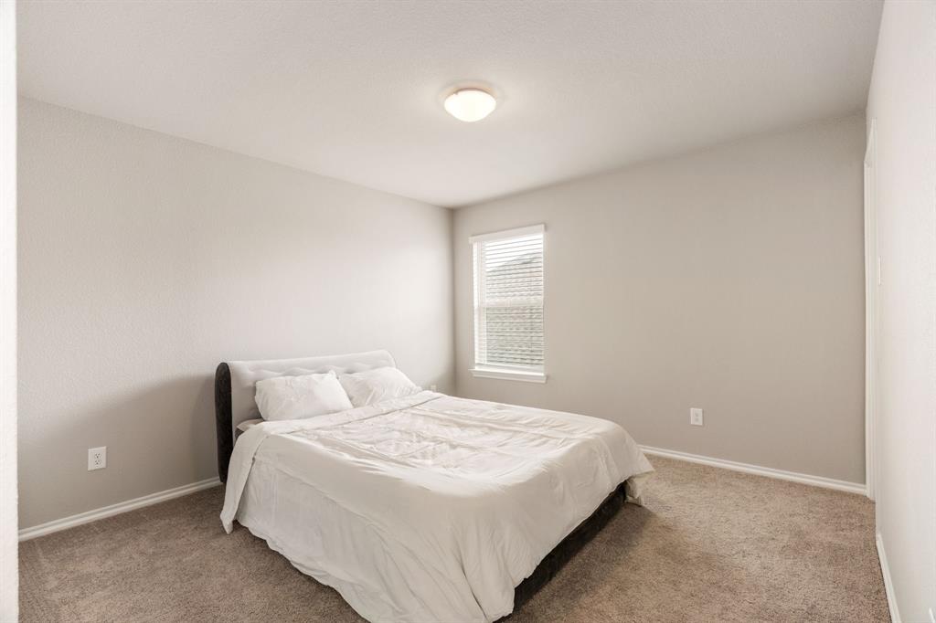 321 Pasture Drive Midlothian, TX 76065 - Photo 29 of 40 a bedroom with a bed and a window
