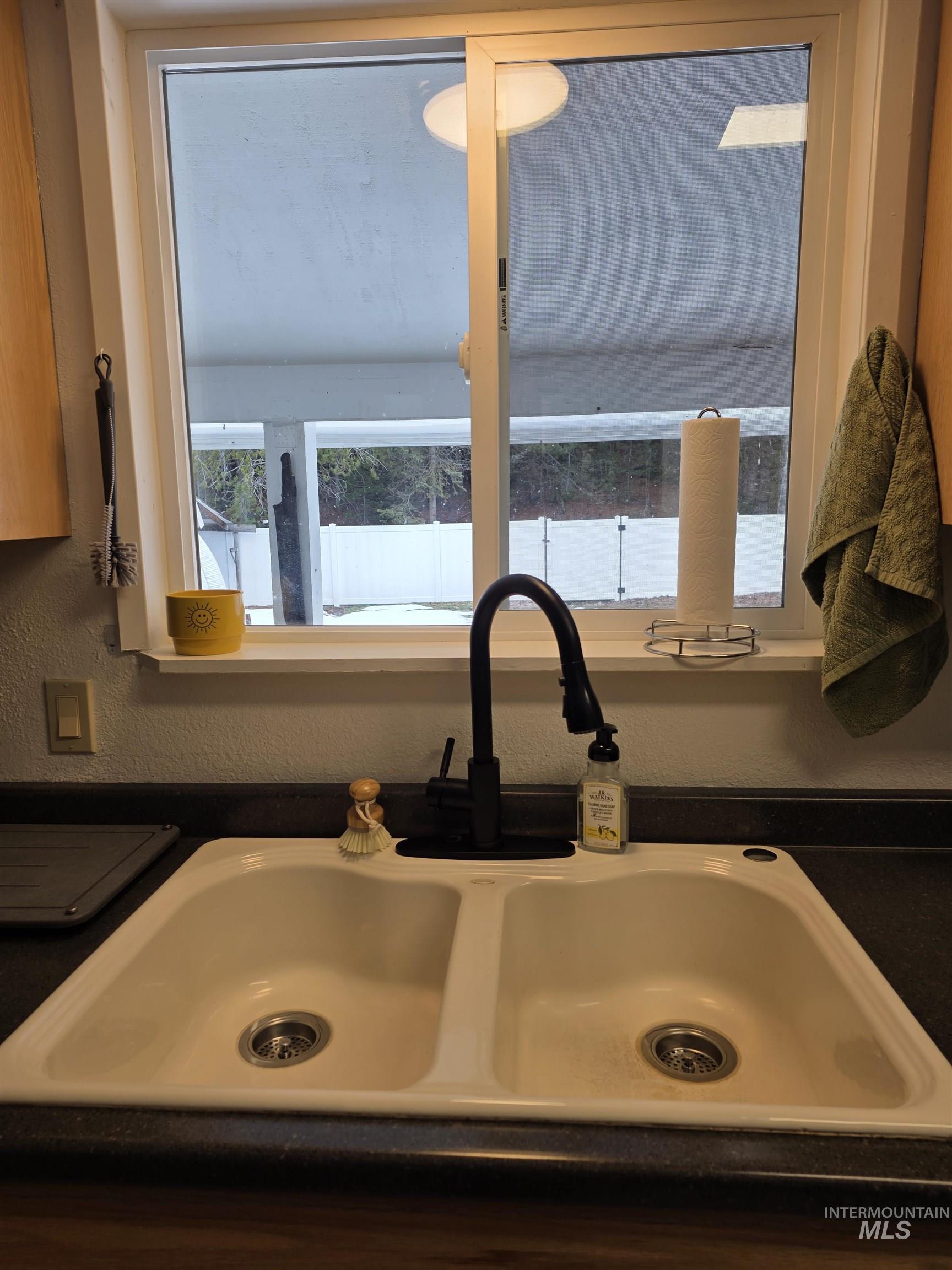 179 Timberline Drive Pierce, ID 83546 - Photo 15 of 24 Kitchen view of dark countertops and a sink