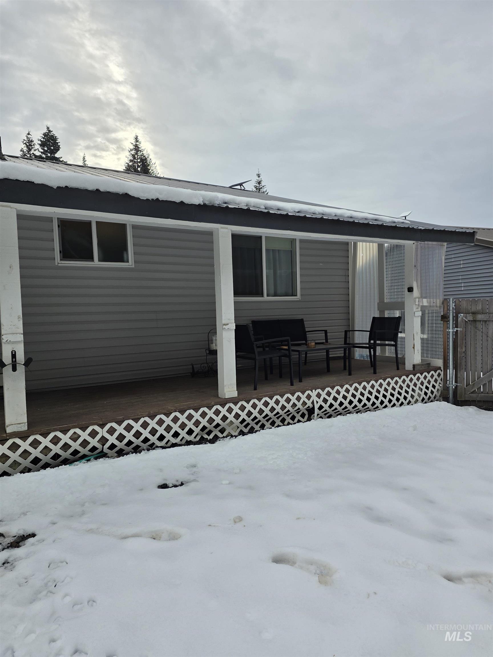 179 Timberline Drive Pierce, ID 83546 - Photo 4 of 24 Back of house with a wooden deck