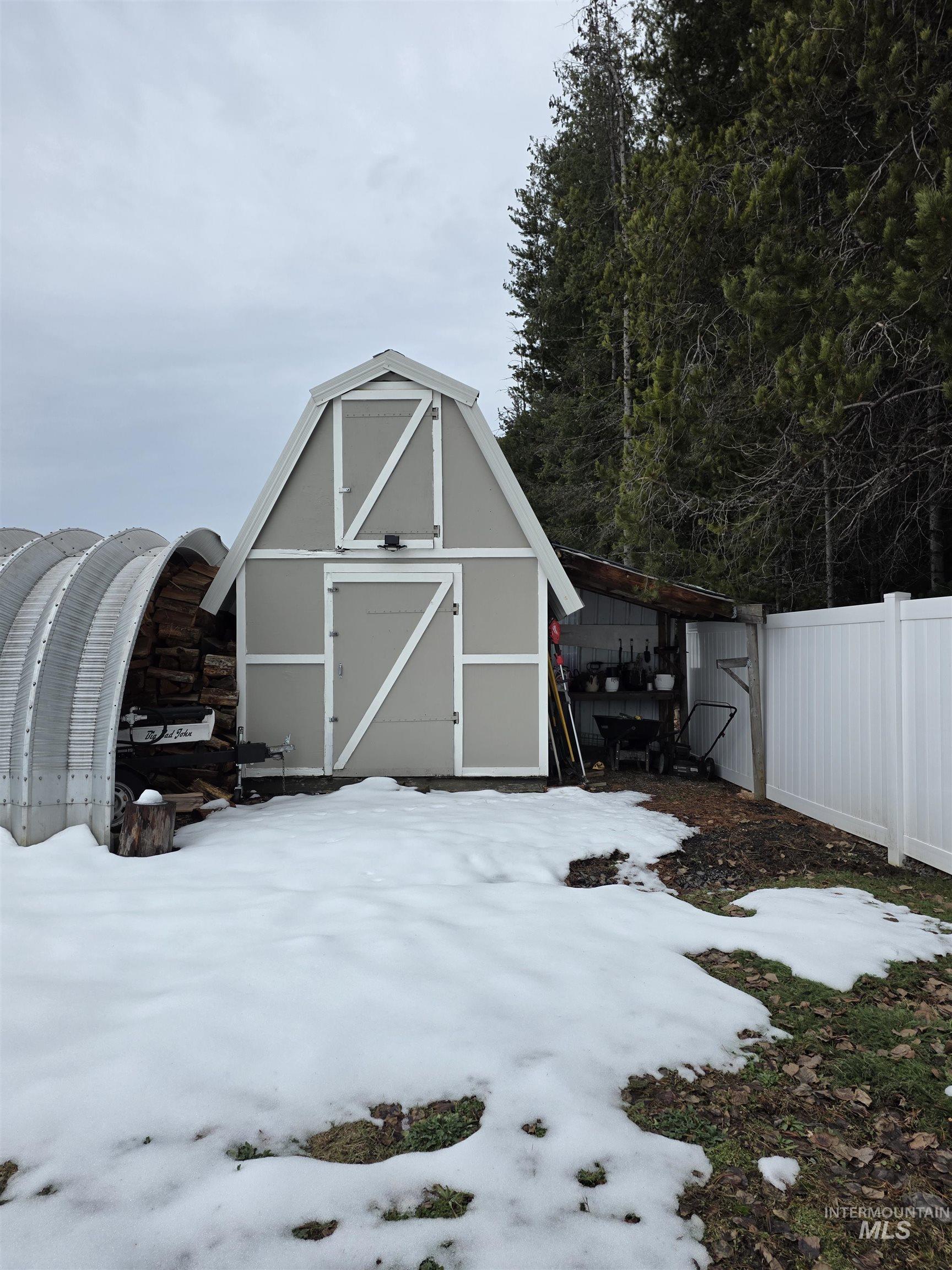 179 Timberline Drive Pierce, ID 83546 - Photo 6 of 24 Snow covered structure featuring a storage shed
