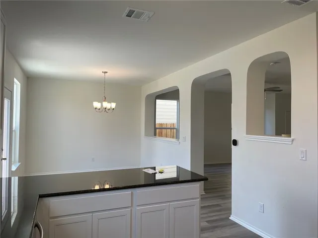a bathroom with sinks and mirror