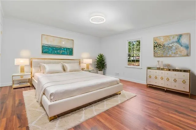 a bedroom with a bed and a night stand