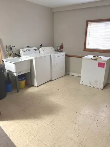 a utility room with a window dryer and washer