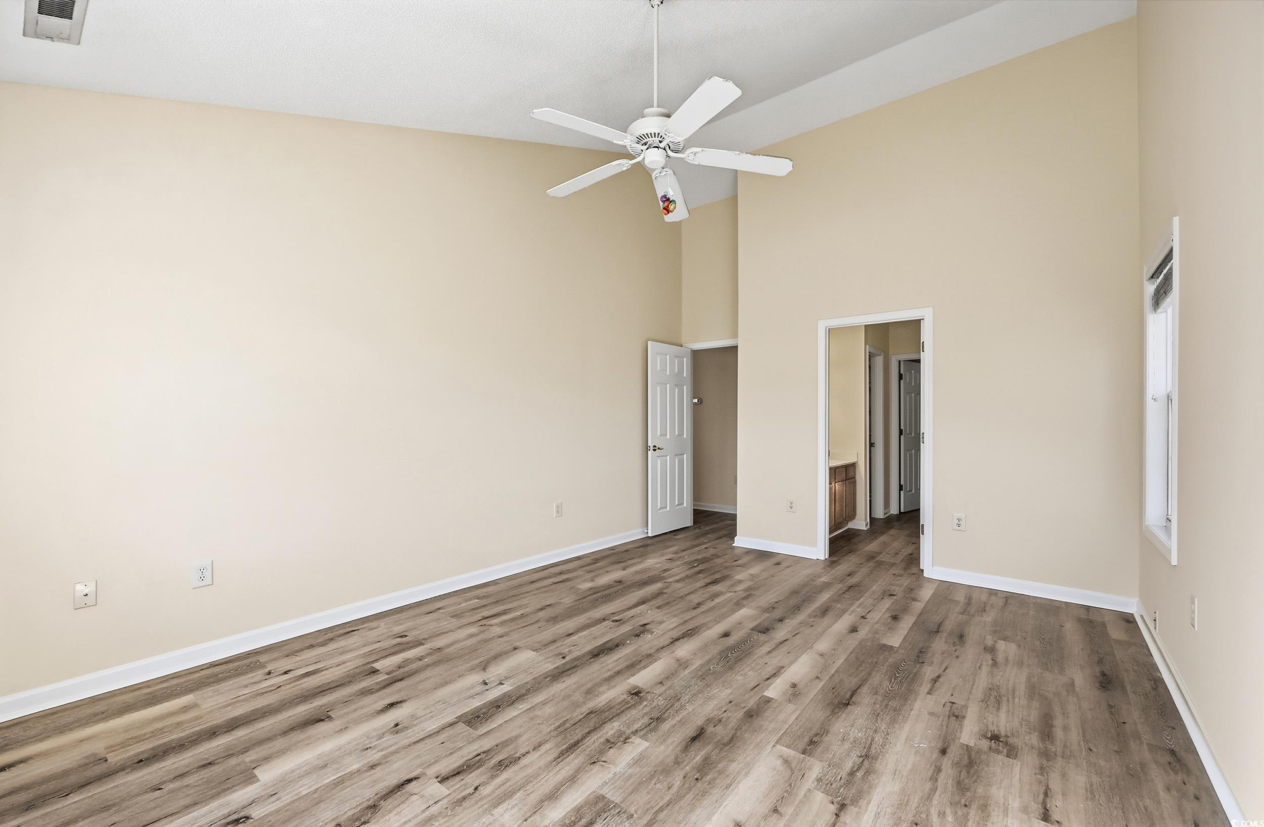 323 Chastain Court Murrells Inlet, SC 29576 - Photo 23 of 37 Unfurnished bedroom with light wood-style floors, a closet, and a ceiling fan