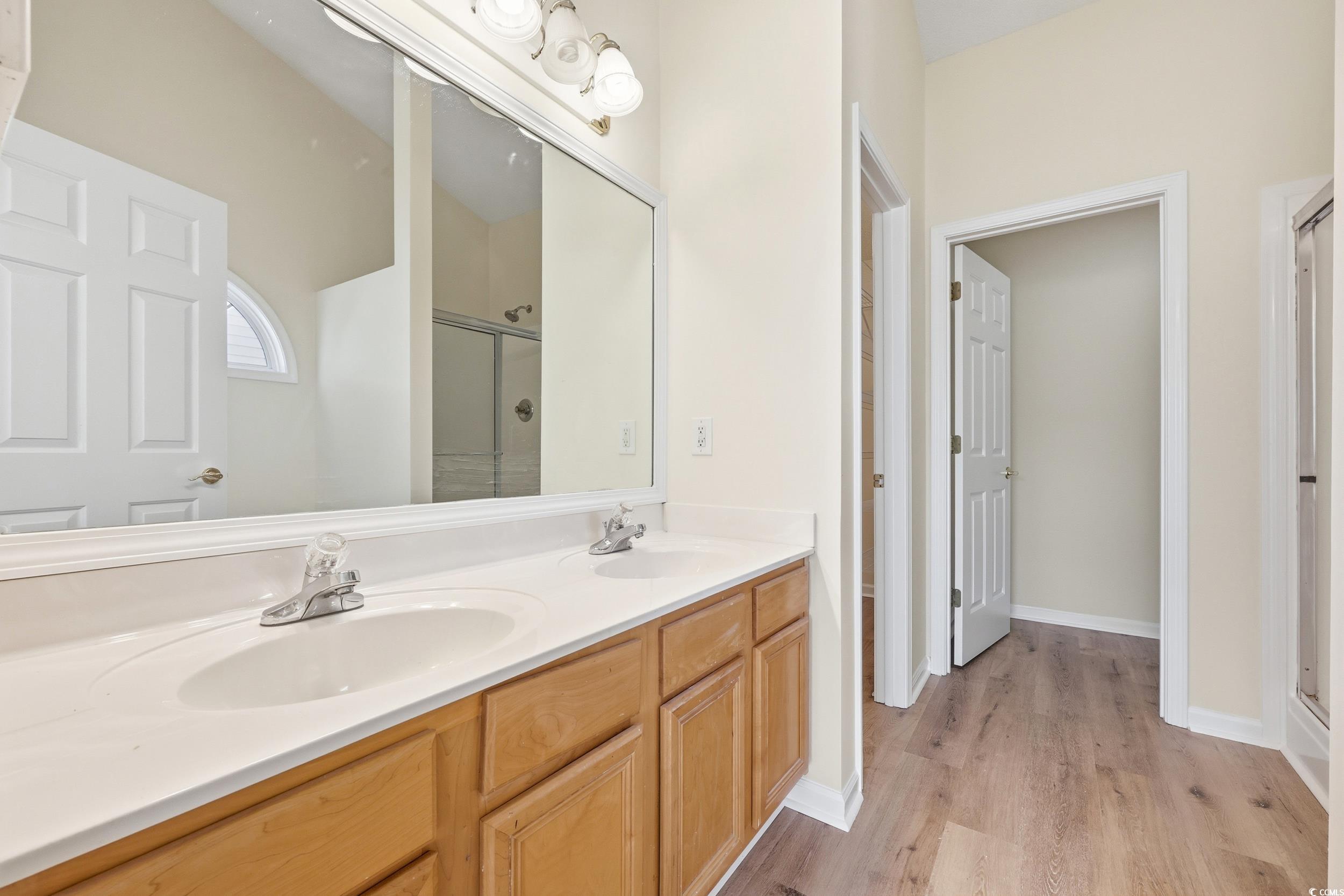 323 Chastain Court Murrells Inlet, SC 29576 - Photo 24 of 37 Bedroom with lofted ceiling, ceiling fan, light wood-style flooring, and a textured ceiling