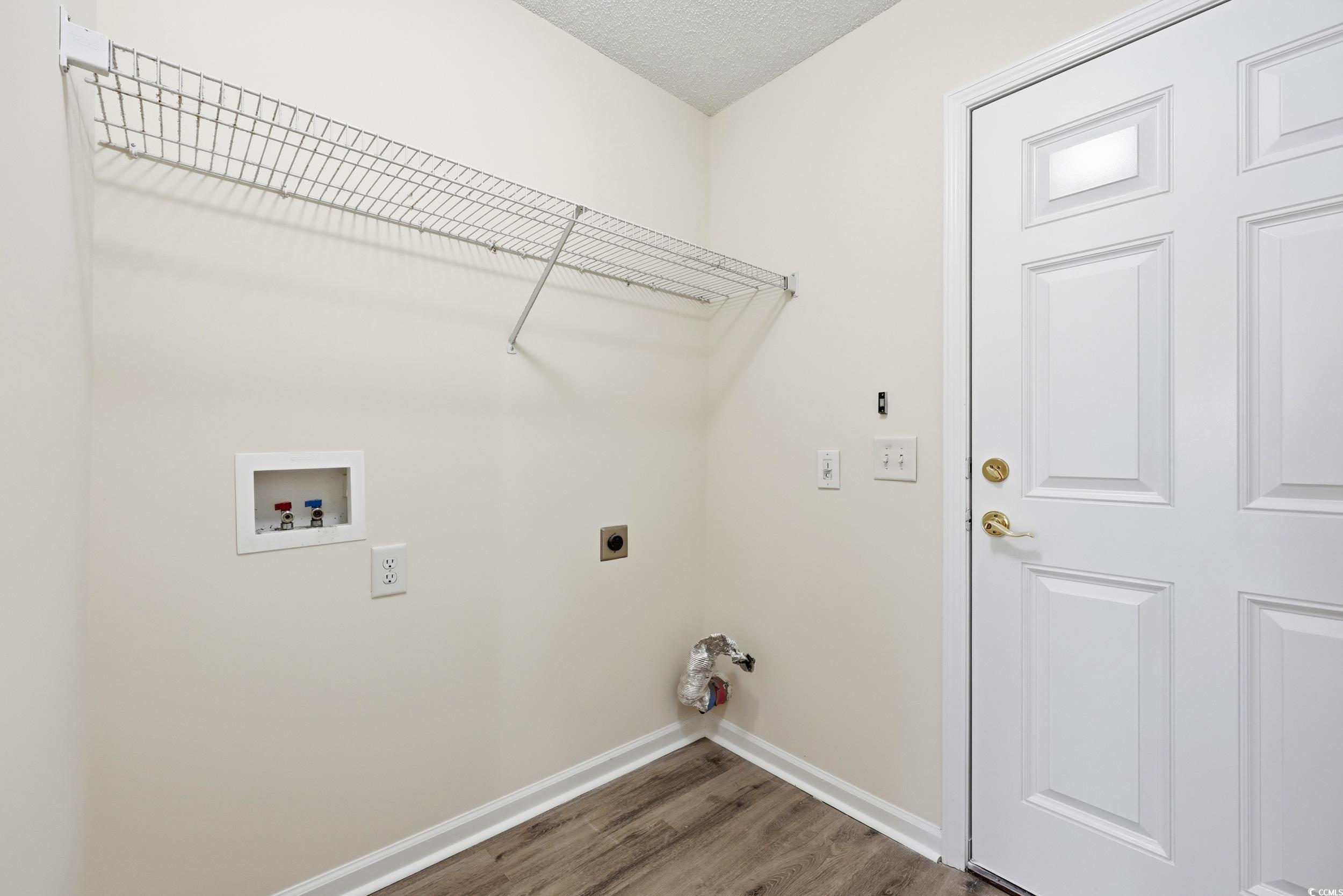 323 Chastain Court Murrells Inlet, SC 29576 - Photo 28 of 37 Bathroom featuring light wood finished floors, a garden tub, and a shower stall