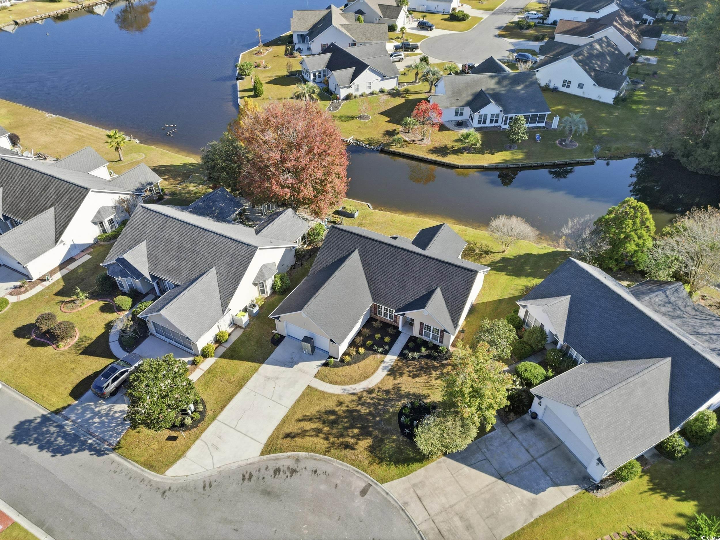 323 Chastain Court Murrells Inlet, SC 29576 - Photo 33 of 37 View of yard with a water view and a patio