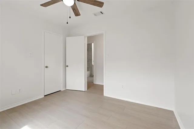 a bathroom with a granite countertop sink mirror and a bathtub