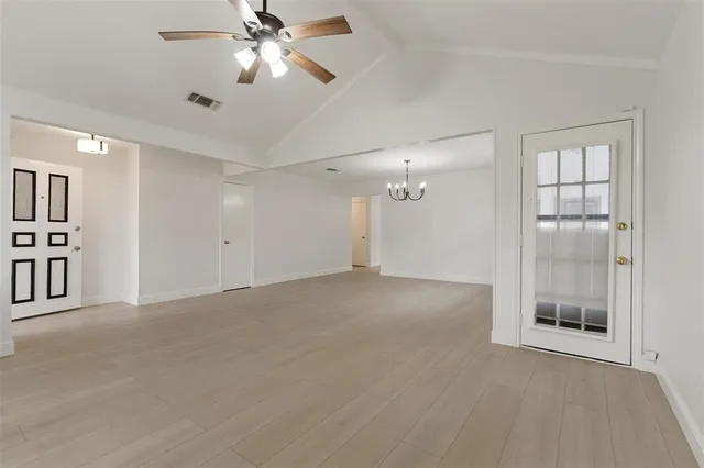 a view of an empty room with a window