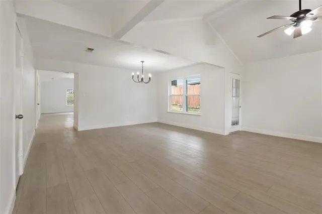 a view of a kitchen with a sink and a fireplace