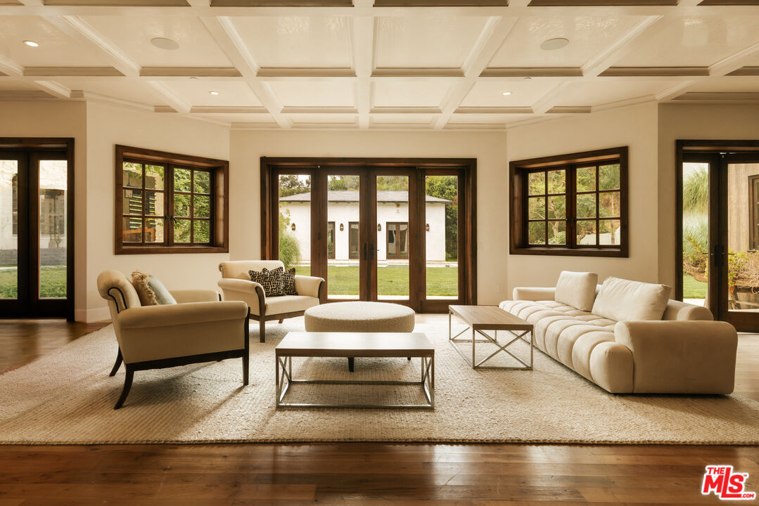 1105 Rivas Canyon Road Pacific Palisades, CA 90272 - Photo 33 of 49 a living room with furniture and large windows
