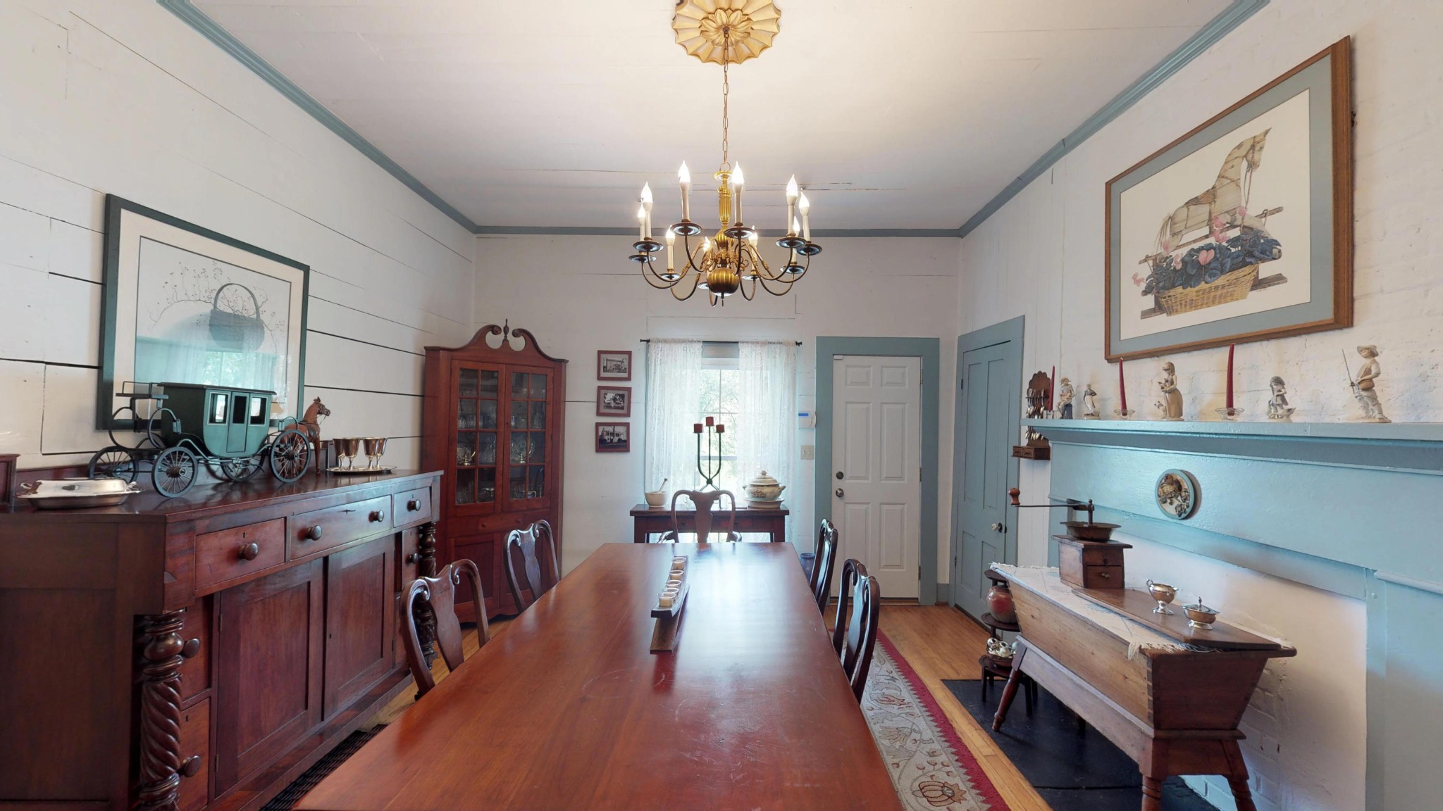 4965 Roberson Spring Road Loudon, TN 37774 - Photo 13 of 39 a view of a dining room with furniture a chandelier and wooden floor