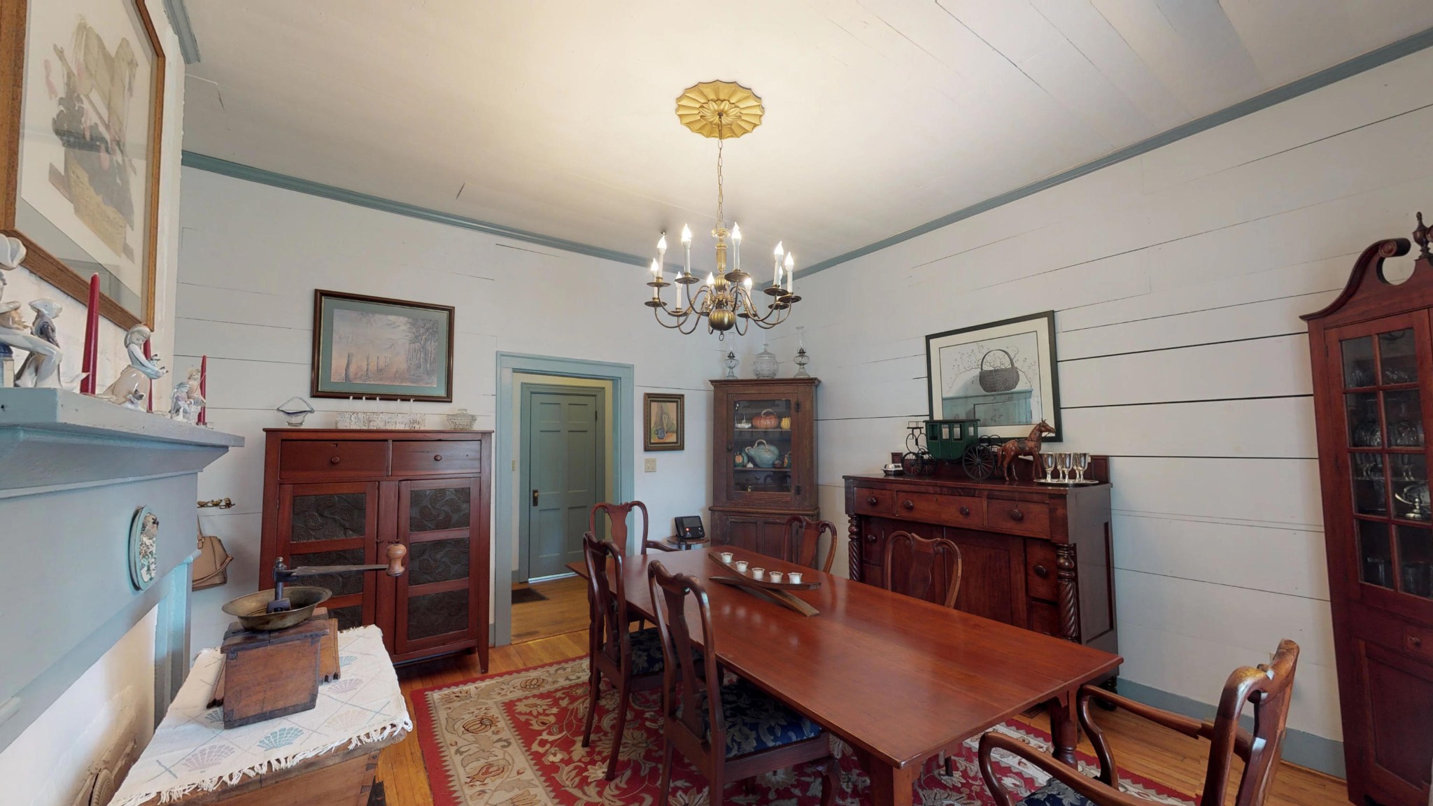 4965 Roberson Spring Road Loudon, TN 37774 - Photo 14 of 39 a view of a dining room with furniture a chandelier and wooden floor