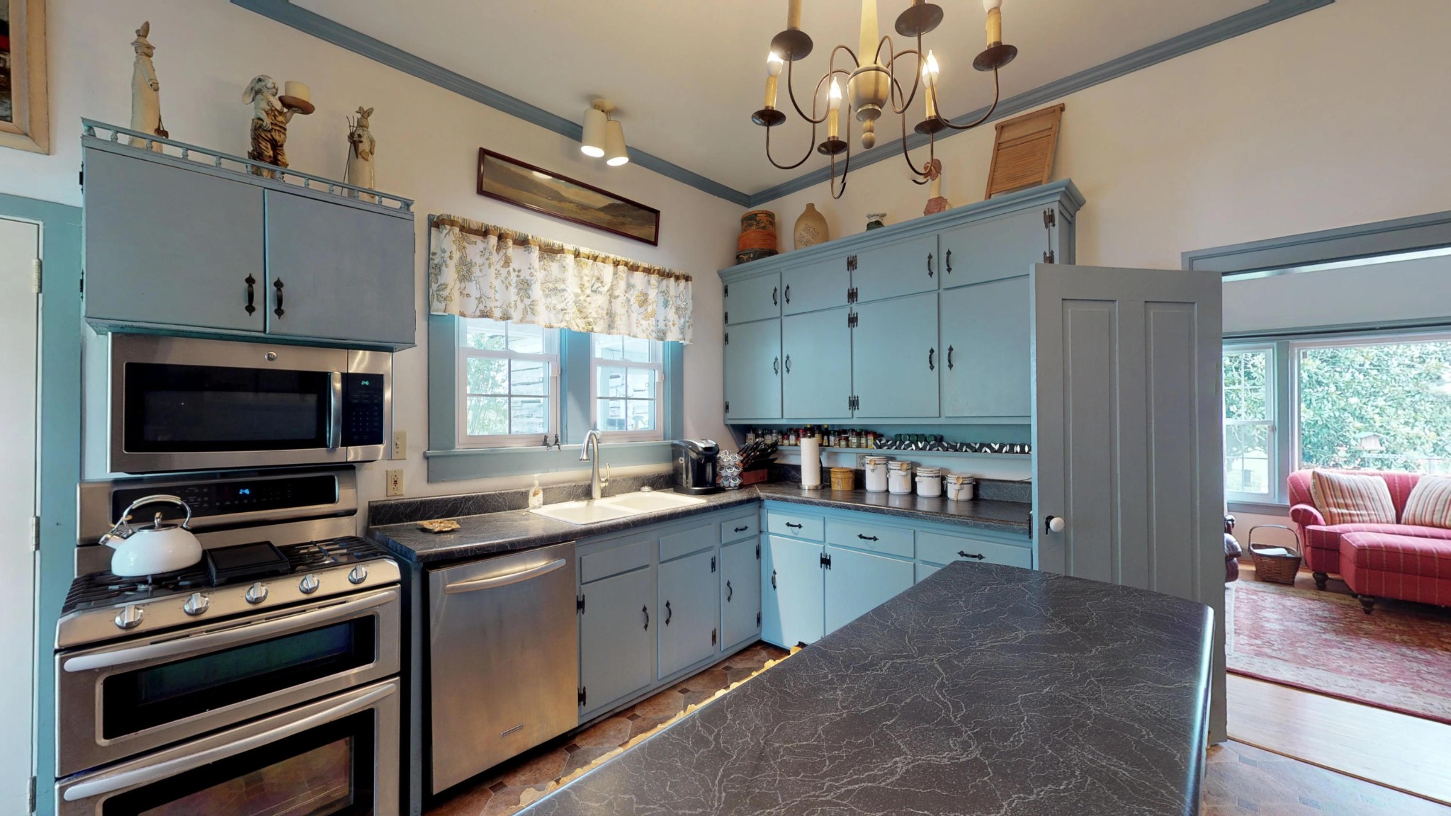 4965 Roberson Spring Road Loudon, TN 37774 - Photo 16 of 39 a kitchen with wooden cabinets and stainless steel appliances