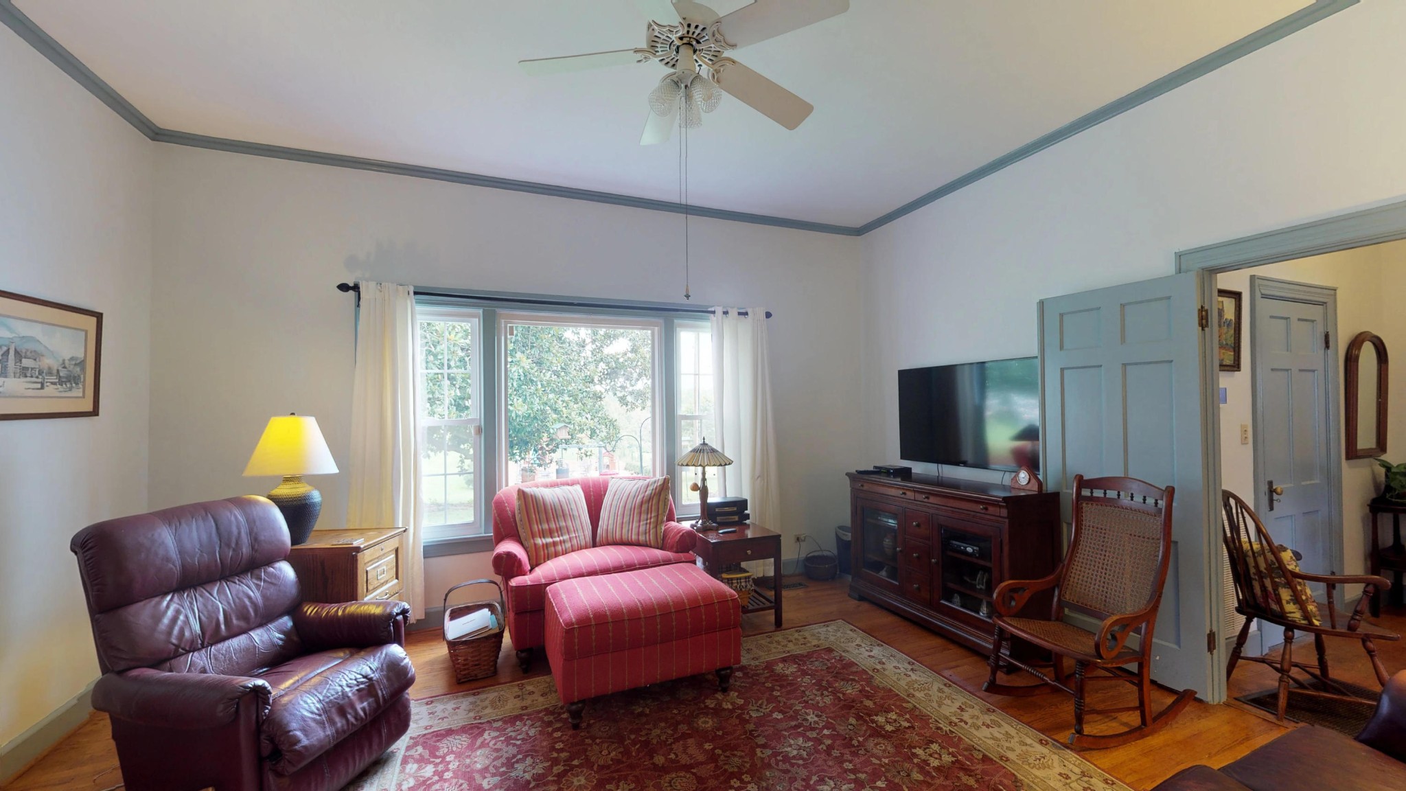 4965 Roberson Spring Road Loudon, TN 37774 - Photo 21 of 39 a living room with furniture a flat screen tv and a window
