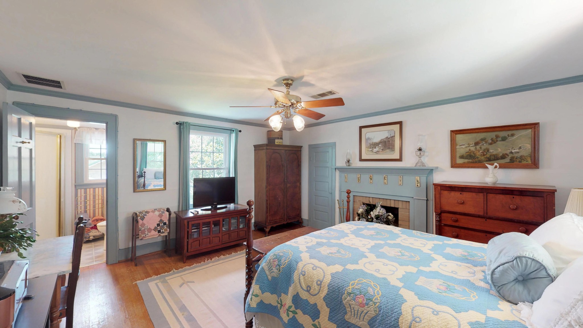 4965 Roberson Spring Road Loudon, TN 37774 - Photo 30 of 39 a bedroom with a large bed a flat tv screen and dresser