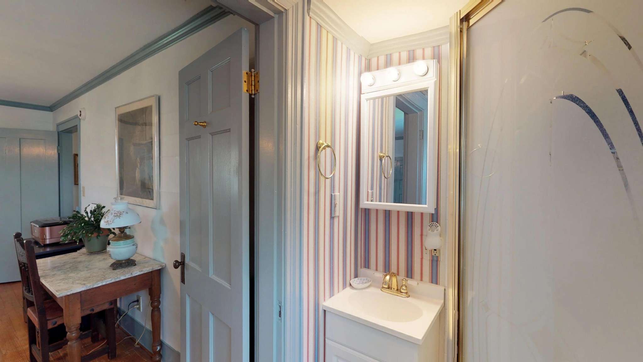 4965 Roberson Spring Road Loudon, TN 37774 - Photo 35 of 39 a bathroom with a sink a mirror and a shower